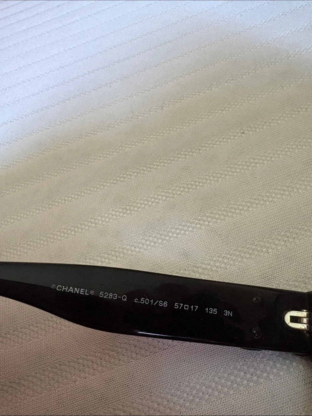 CHANEL Black Oversized Round Women's Sunglasses with iconic bows on each side.